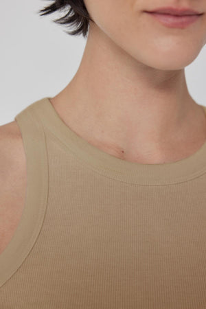 Close-up of a person wearing a Velvet by Jenny Graham CRUZ tank top, showing the shoulder and neckline.
