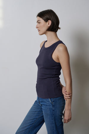 A woman wearing stretch jeans and a Velvet by Jenny Graham CRUZ tank top.
