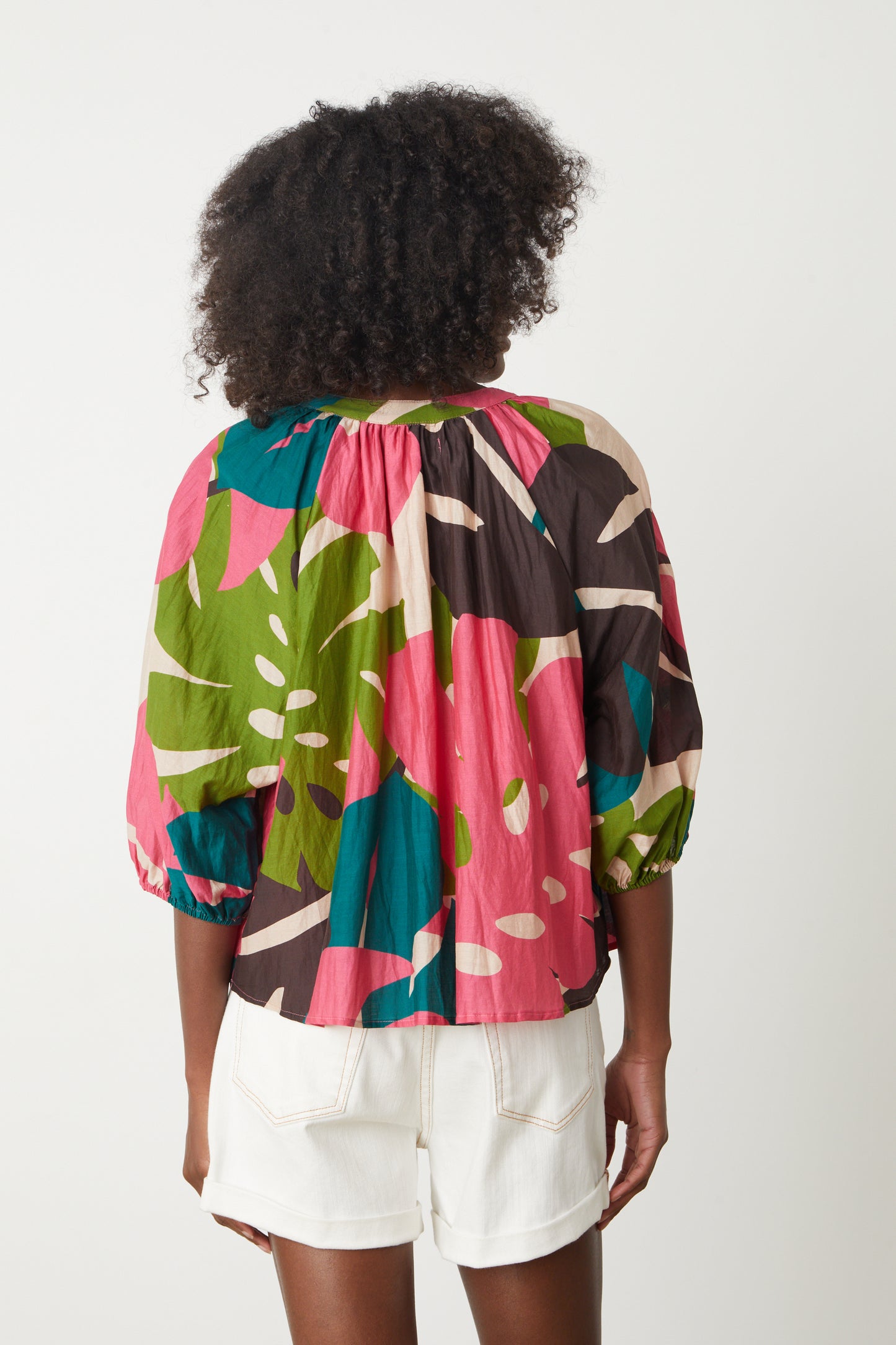The back view of a woman wearing an Ariel Printed Top by Velvet by Graham & Spencer blouse.-26577406001345