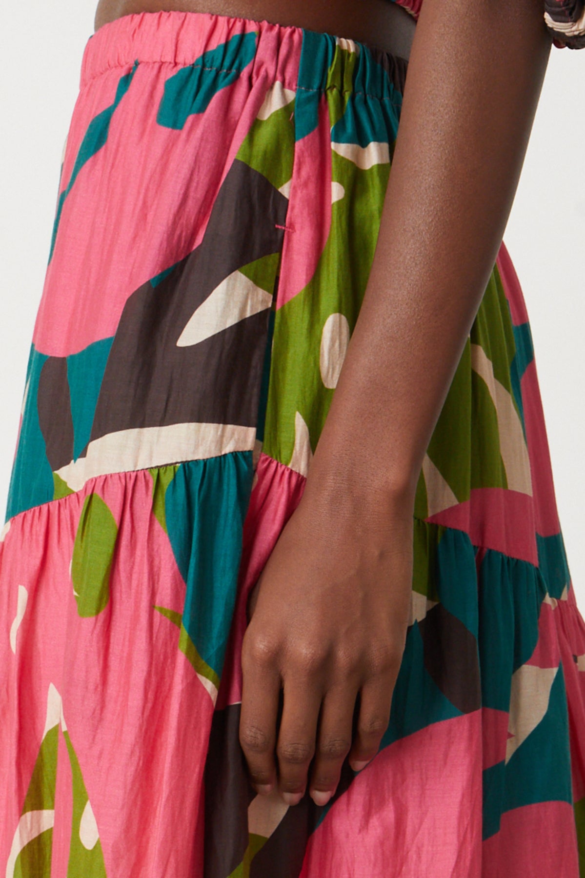 A woman wearing a Velvet by Graham & Spencer LYDIA PRINTED TIERED SKIRT.-26514115199169