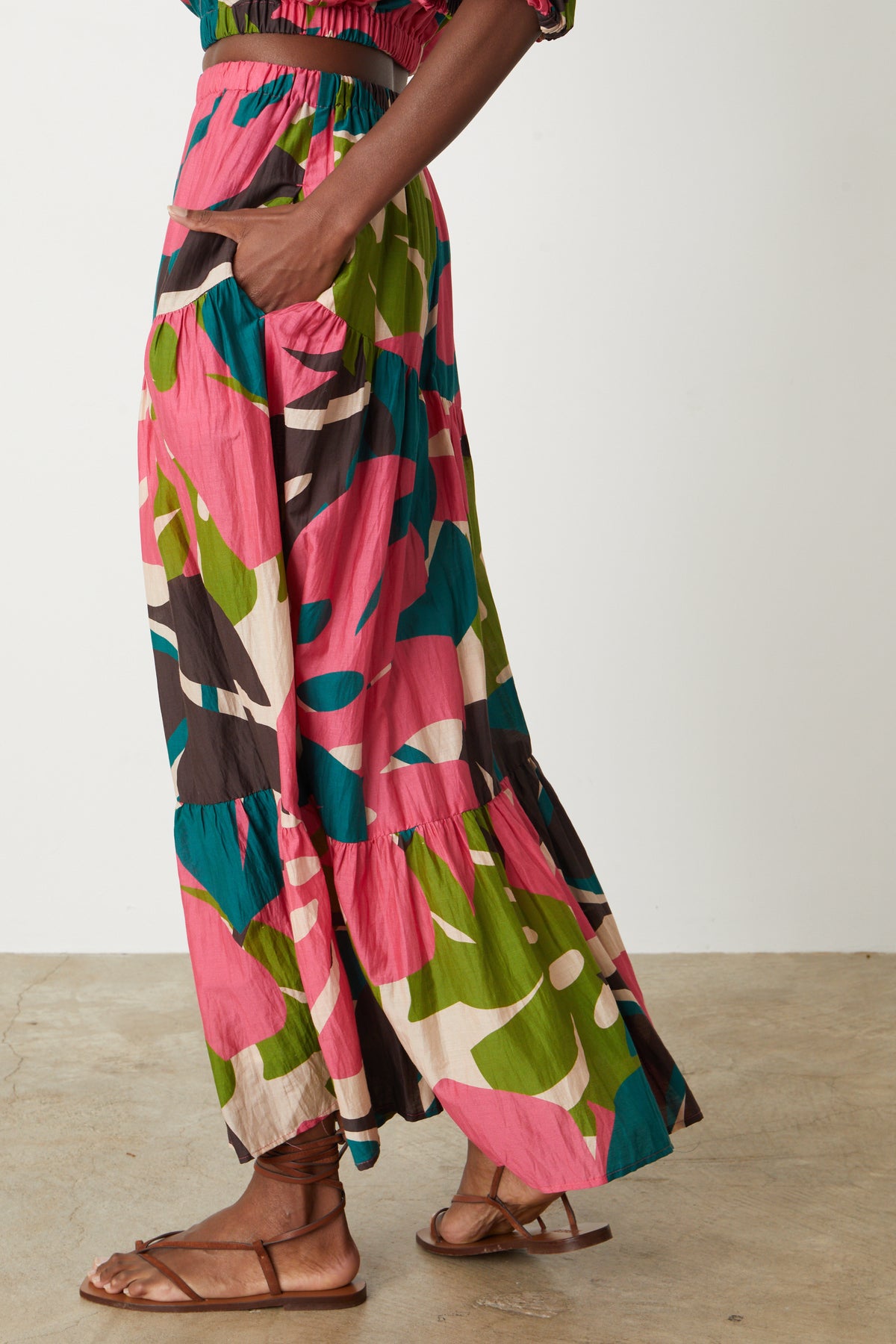The view of a woman wearing Velvet by Graham & Spencer's LYDIA PRINTED TIERED SKIRT.-26514115231937