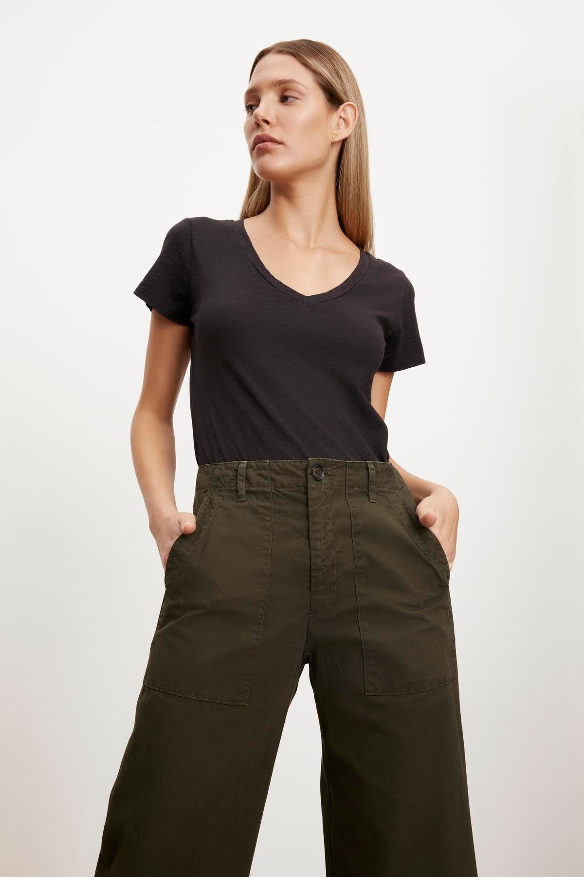  The model is wearing a t-shirt and Velvet by Graham & Spencer MYA COTTON CANVAS PANT. 