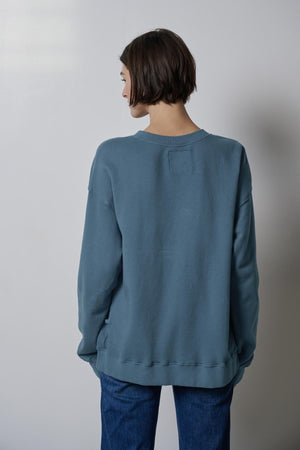 The back view of a woman wearing a slouchy Velvet by Jenny Graham ABBOT SWEATSHIRT.