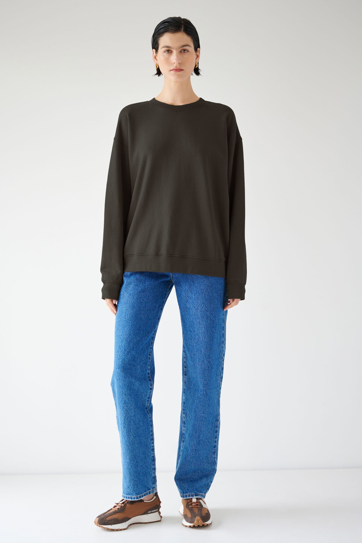   A woman sporting a versatile styling in the Velvet by Jenny Graham Abbot Sweatshirt made of organic cotton. 
