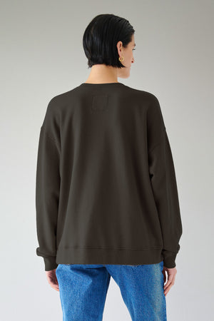 Styling versatility of a woman in an ABBOT SWEATSHIRT by Velvet by Jenny Graham with fleecy interior.