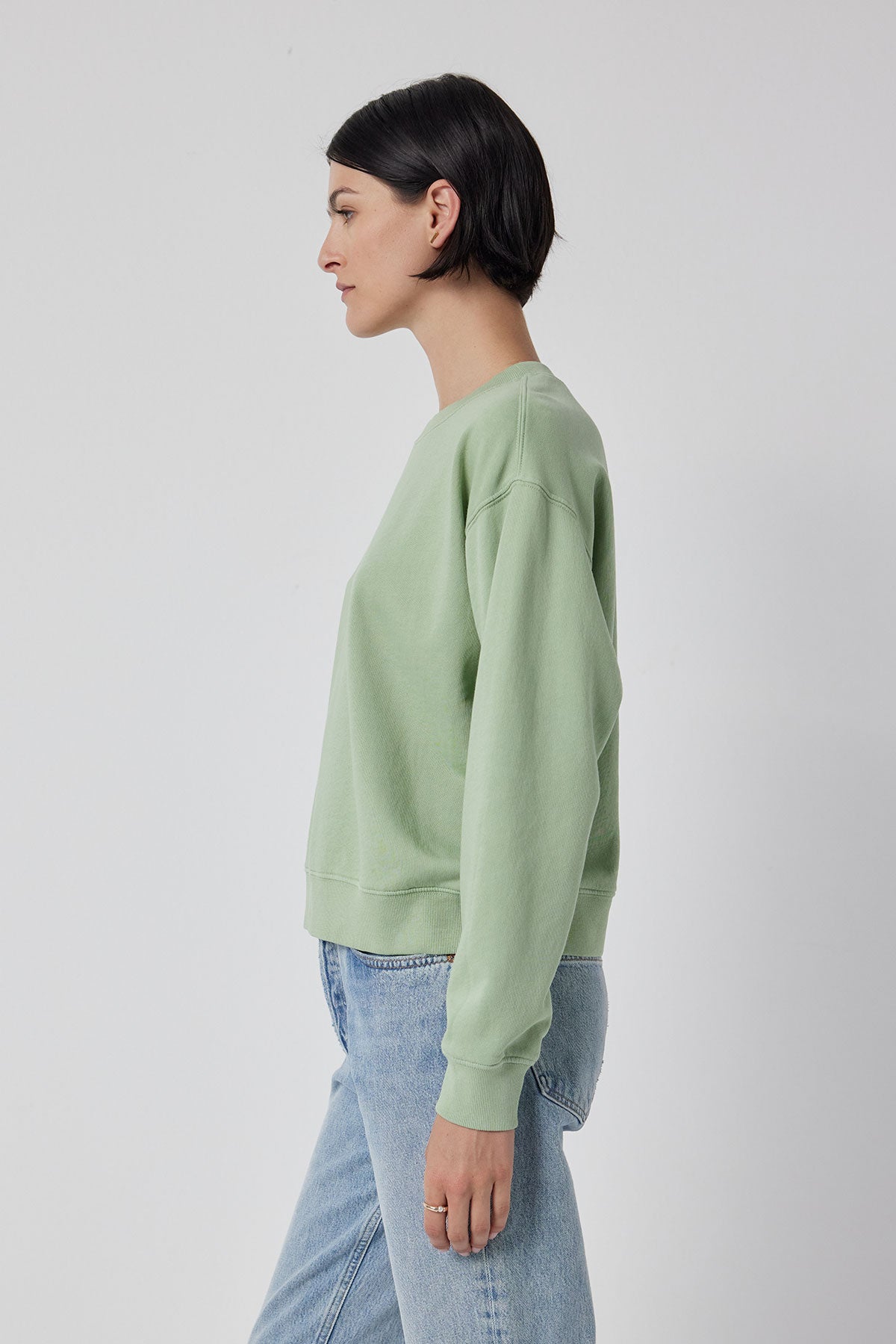 The model is wearing a Velvet by Jenny Graham Ynez sweatshirt and jeans.-36212423196865