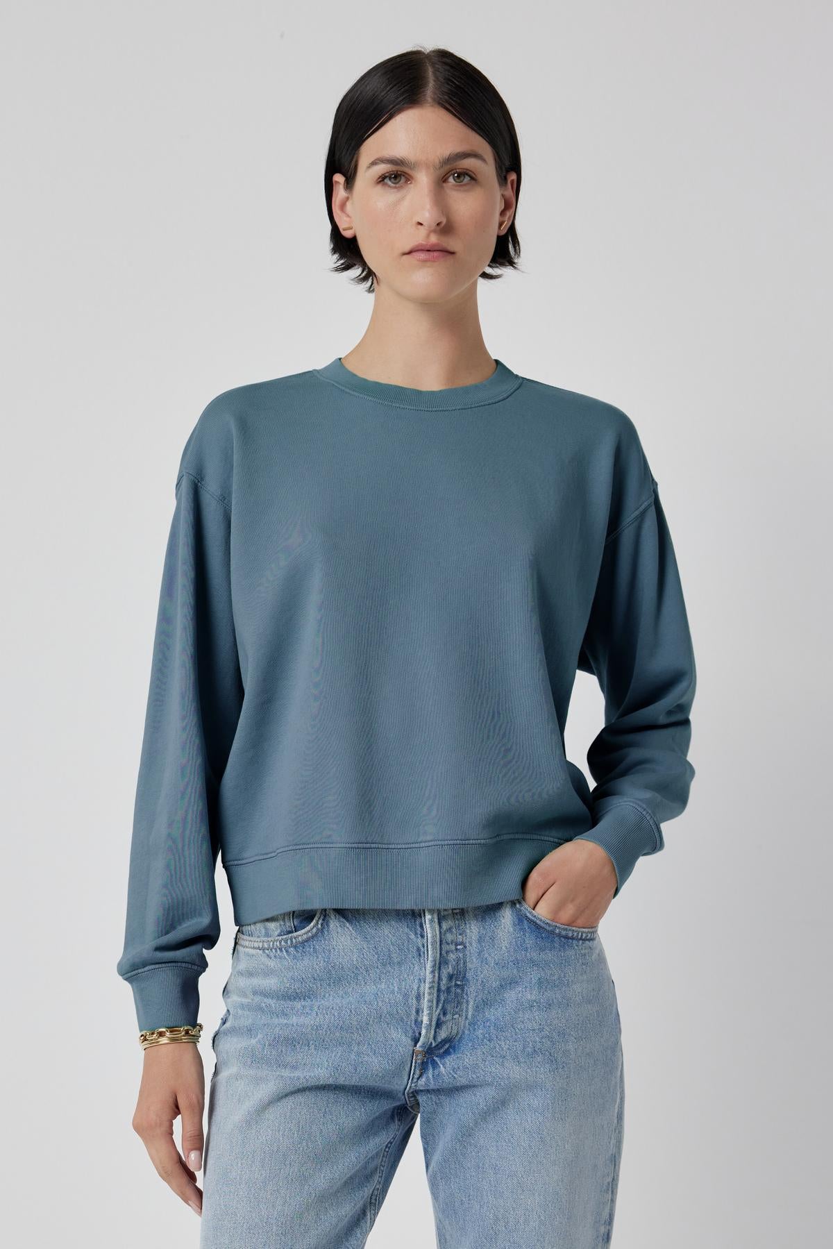   The model is wearing a Velvet by Jenny Graham Ynez sweatshirt and jeans. 
