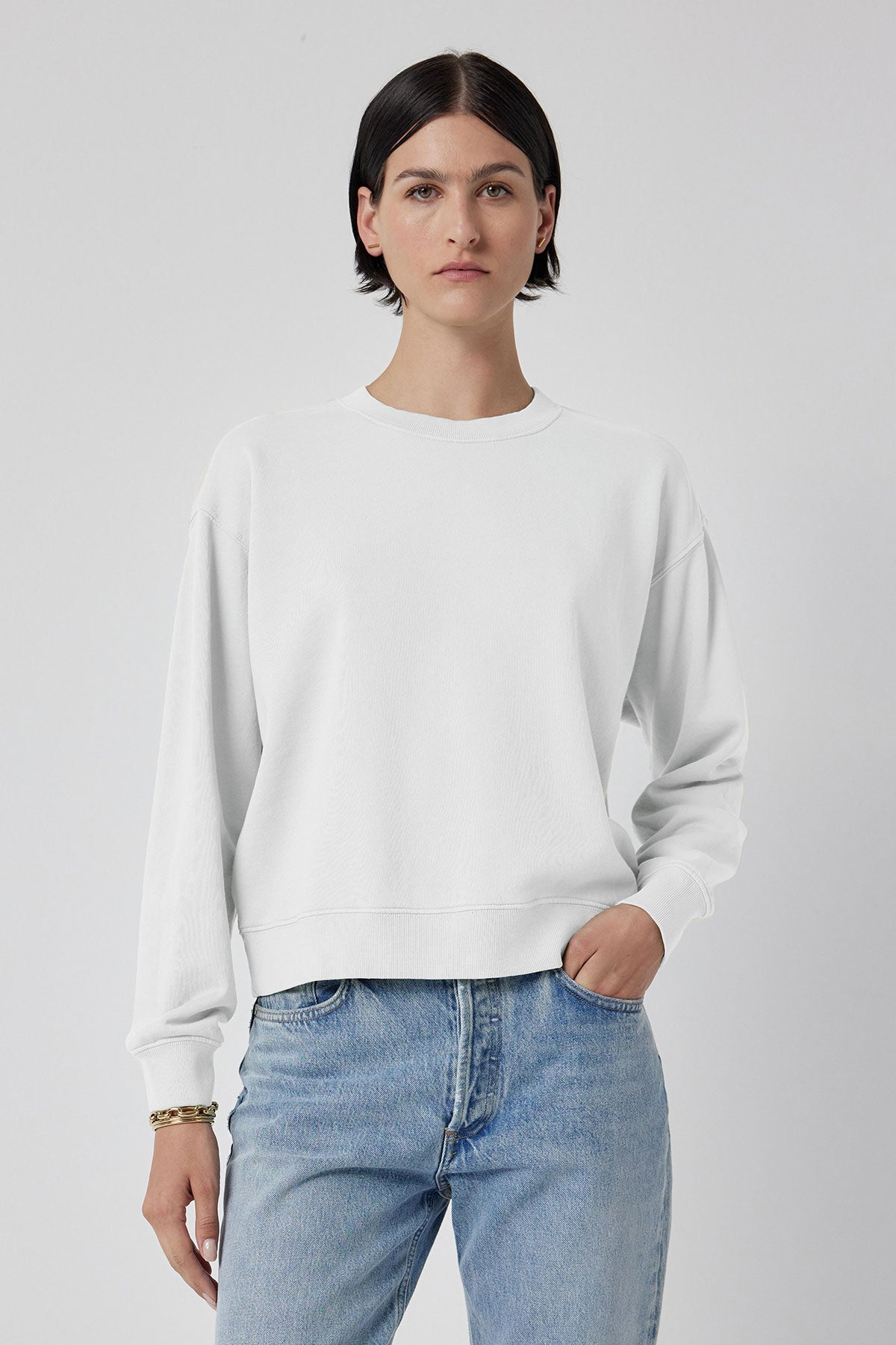   The model is wearing a Velvet by Jenny Graham YNEZ sweatshirt and jeans. 