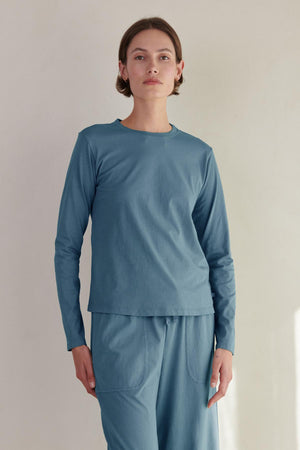 The model is wearing a Velvet by Jenny Graham VICENTE TEE, an organic cotton, long sleeve tee in a relaxed fit.
