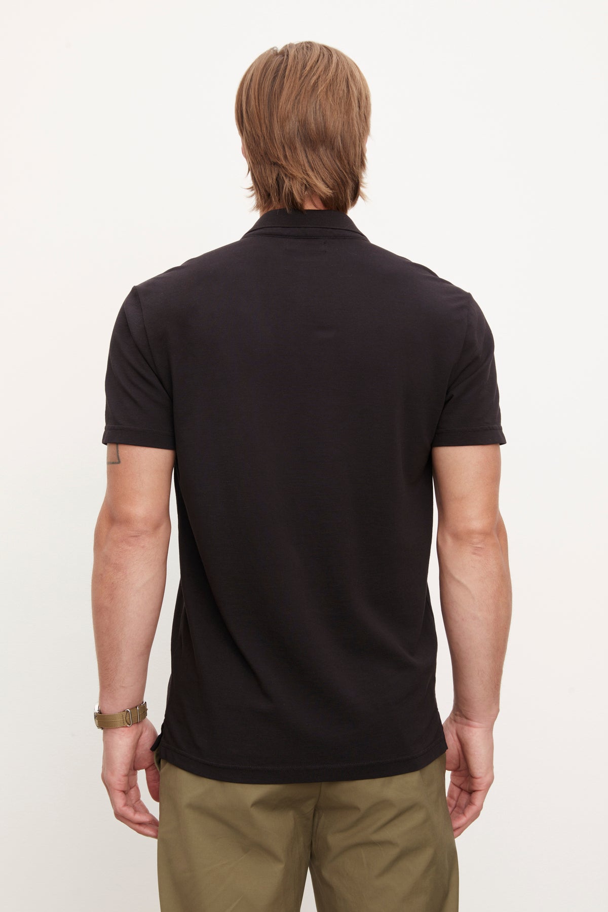 The back view of a man wearing a Velvet by Graham & Spencer Willis Pique Polo shirt.-36009040543937