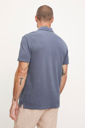 The back view of a man wearing a Velvet by Graham & Spencer Willis Pique Polo shirt.