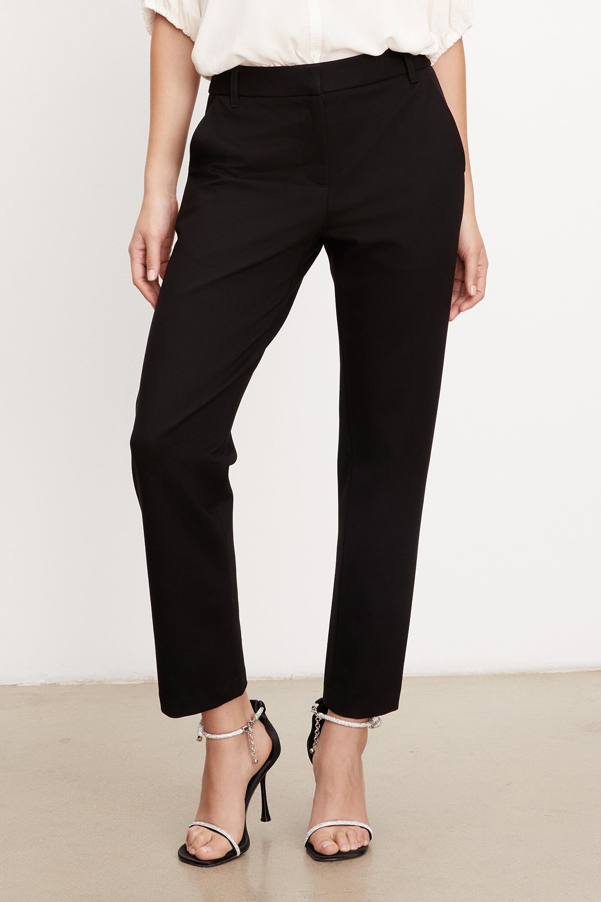 A woman wearing Velvet by Graham & Spencer's JAY PONTI STRAIGHT LEG PANT, made of ponti fabric.-35577760972993