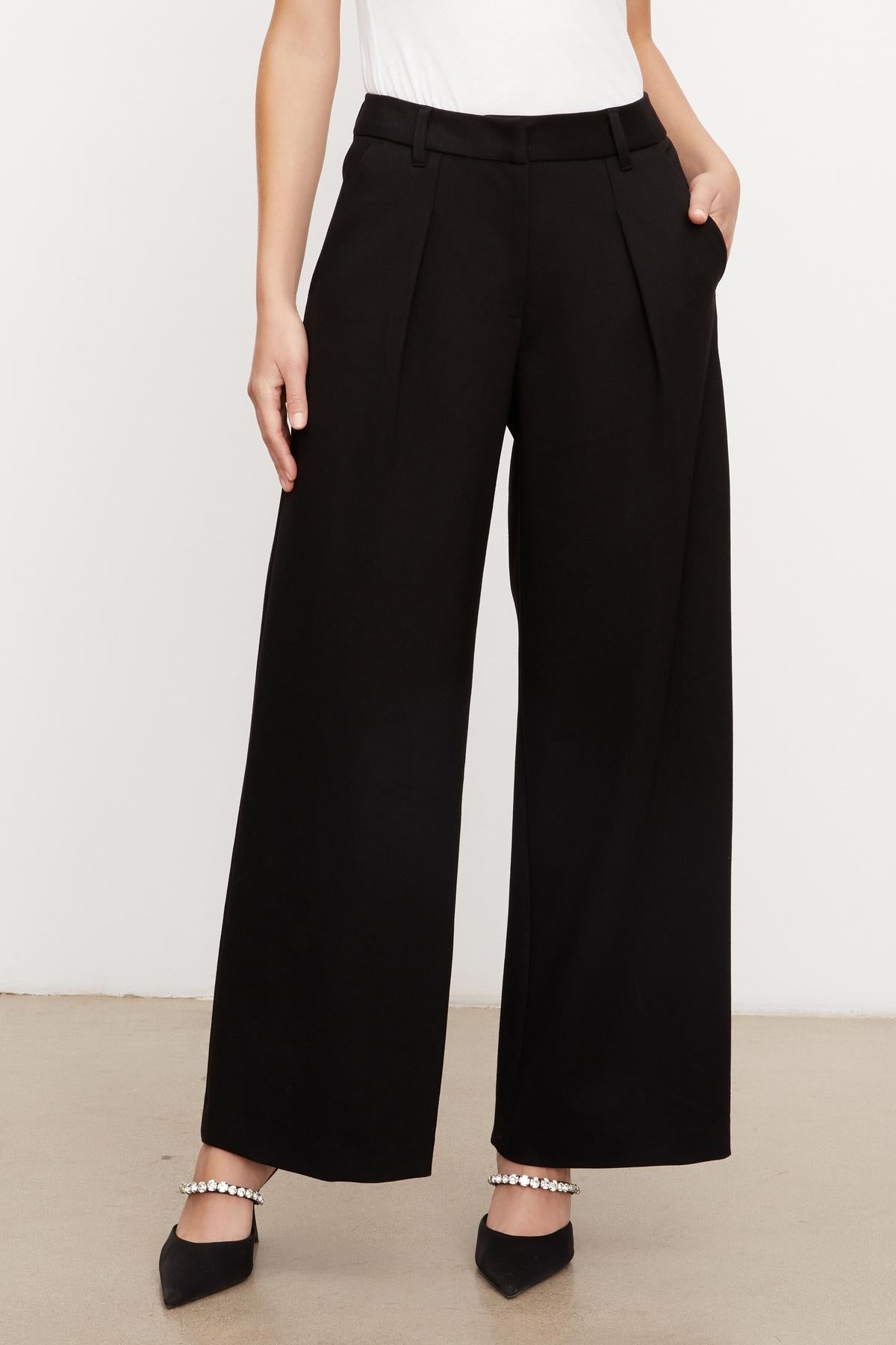 A woman wearing LEONA WIDE LEG PONTI PANT by Velvet by Graham & Spencer.-35696188588225