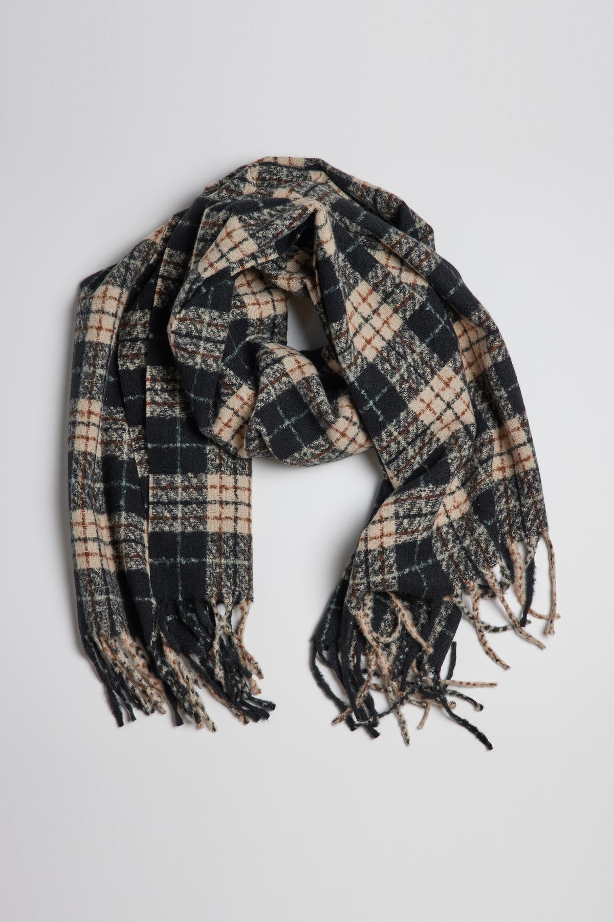 A classic accessory, the PORTLAND PLAID SCARF by Velvet by Graham & Spencer, features a black and tan color scheme with fringe ends.-35211063263425