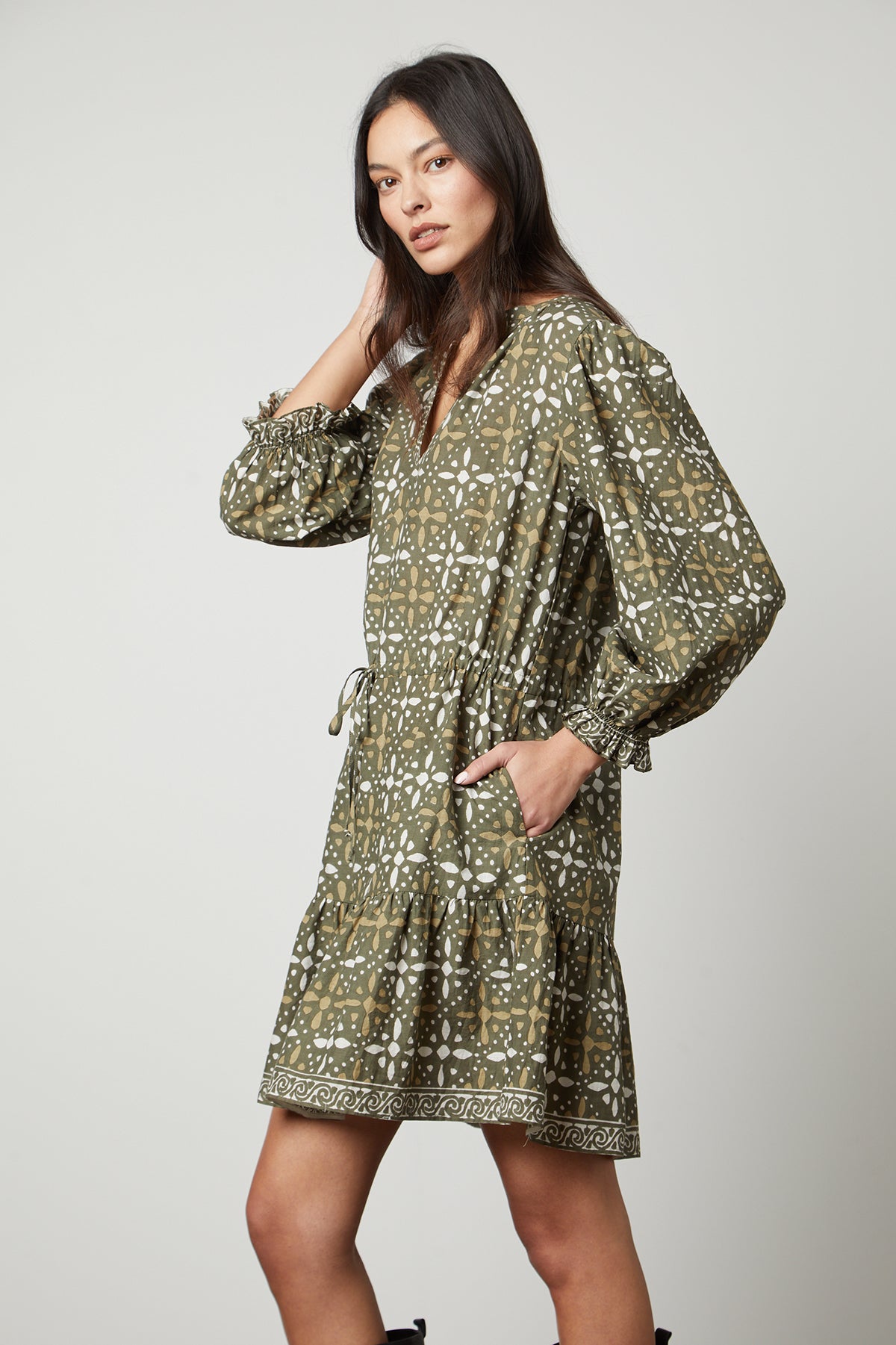 The model is wearing a Velvet by Graham & Spencer KATARINA PRINTED BOHO DRESS.-26799891972289