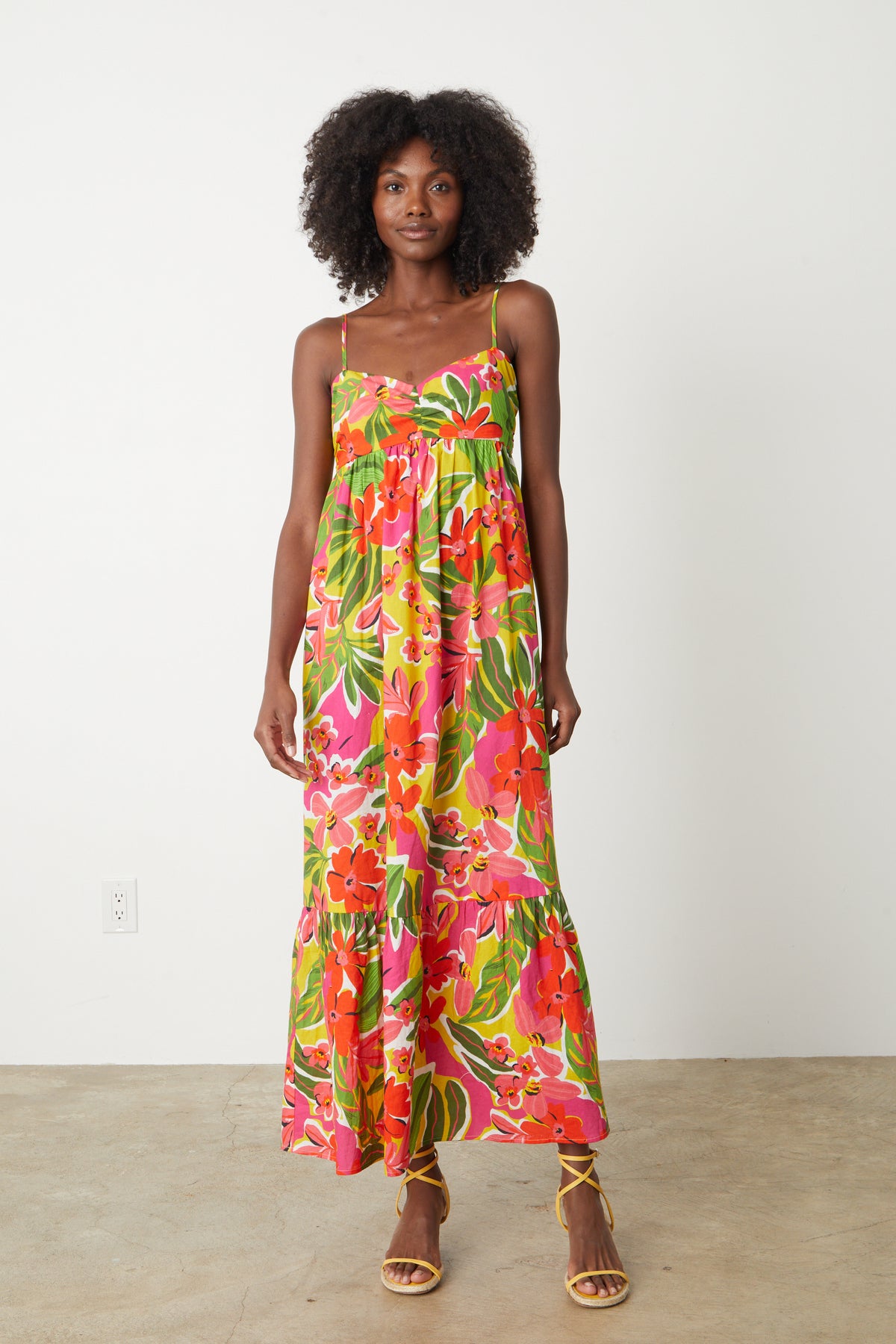   A woman wearing the Velvet by Graham & Spencer KAYLA PRINTED MAXI DRESS. 