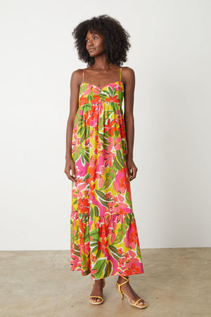 A woman wearing a Velvet by Graham & Spencer KAYLA PRINTED MAXI DRESS.