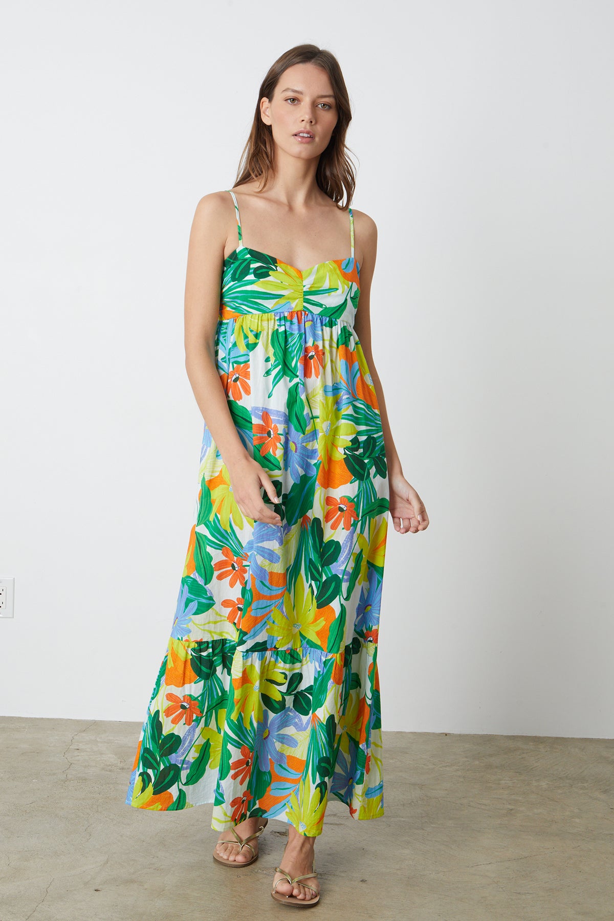   A woman wearing a Velvet by Graham & Spencer Kayla printed maxi dress. 