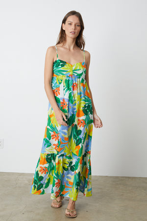 A woman wearing a Velvet by Graham & Spencer Kayla printed maxi dress.
