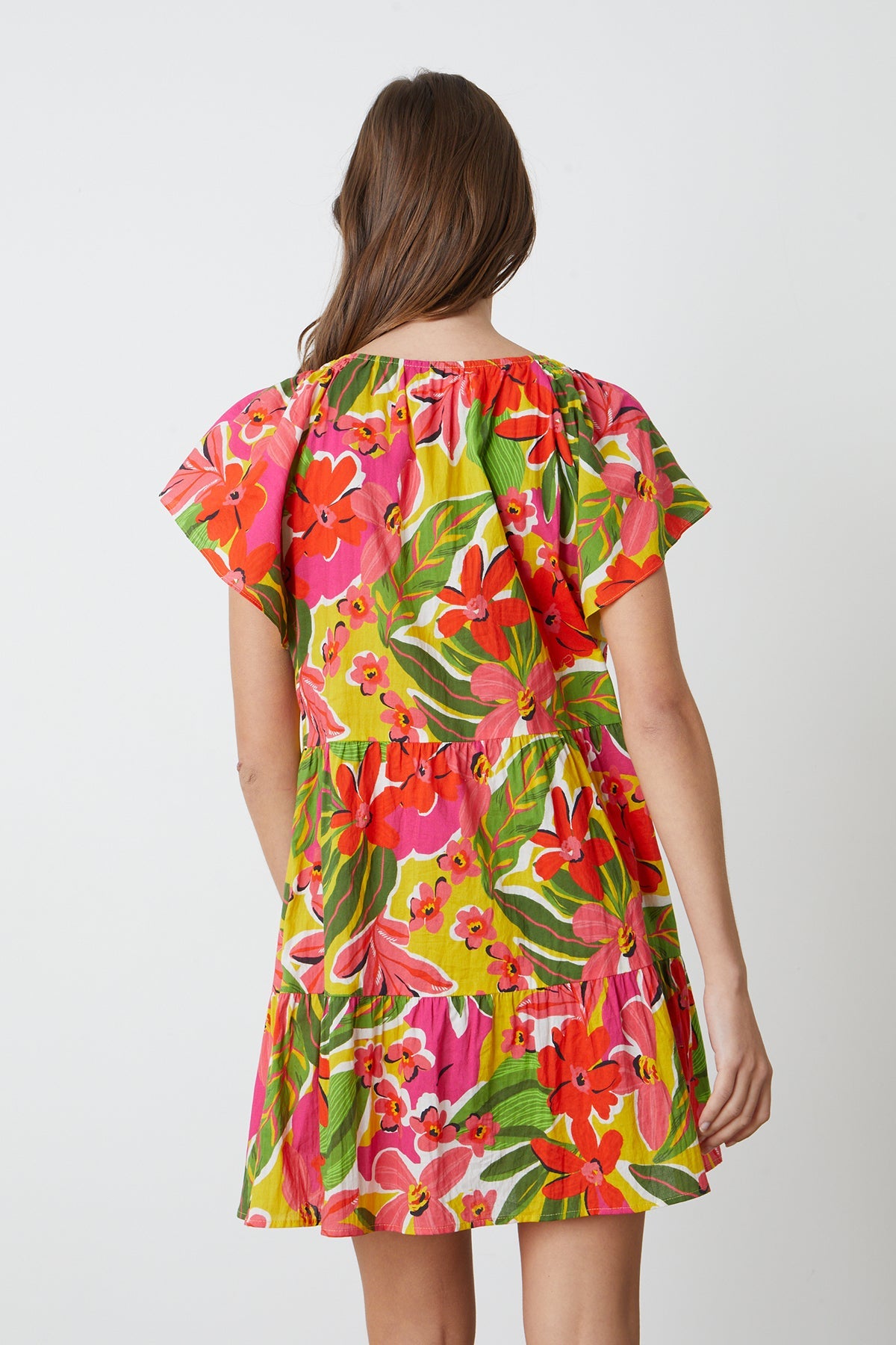   Maeve Tiered Dress in bold floral aloha print with reds, hot pinks and greens back 