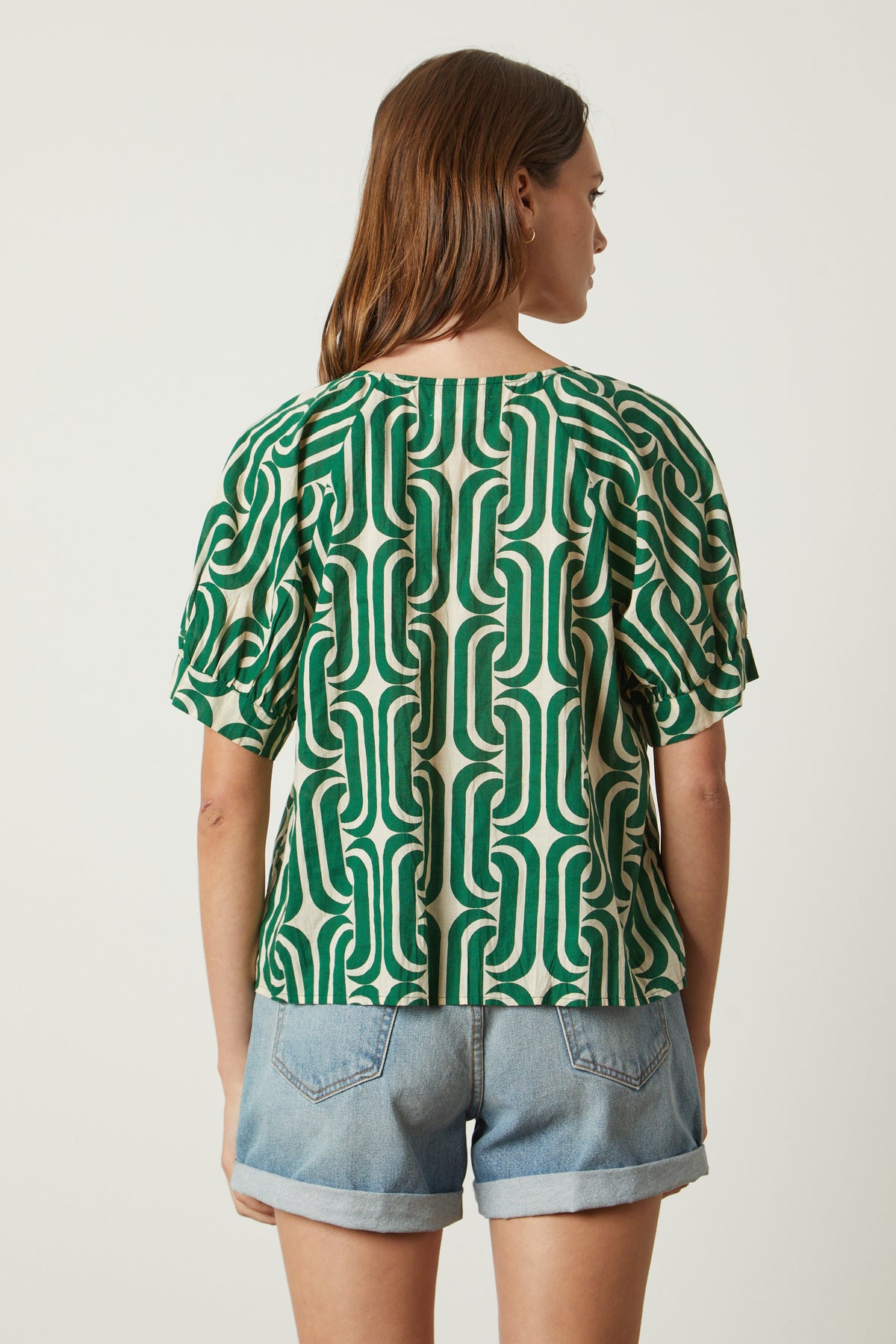   the back view of a woman wearing a Velvet by Graham & Spencer JODY PRINTED TOP. 