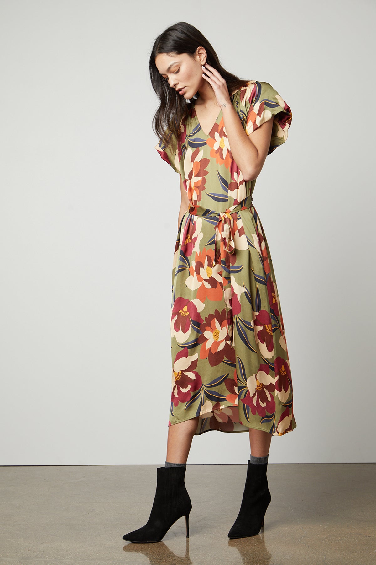   A model wearing a Velvet by Graham & Spencer FRANCINE PRINTED MIDI DRESS. 