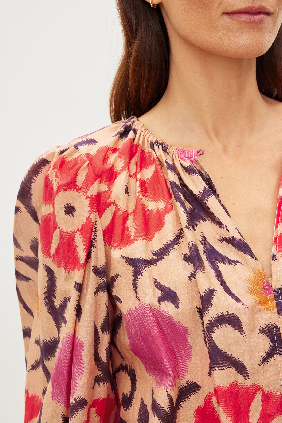 A woman wearing a Velvet by Graham & Spencer FRASER PRINTED SILK COTTON VOILE TOP with a floral print.-35982328561857