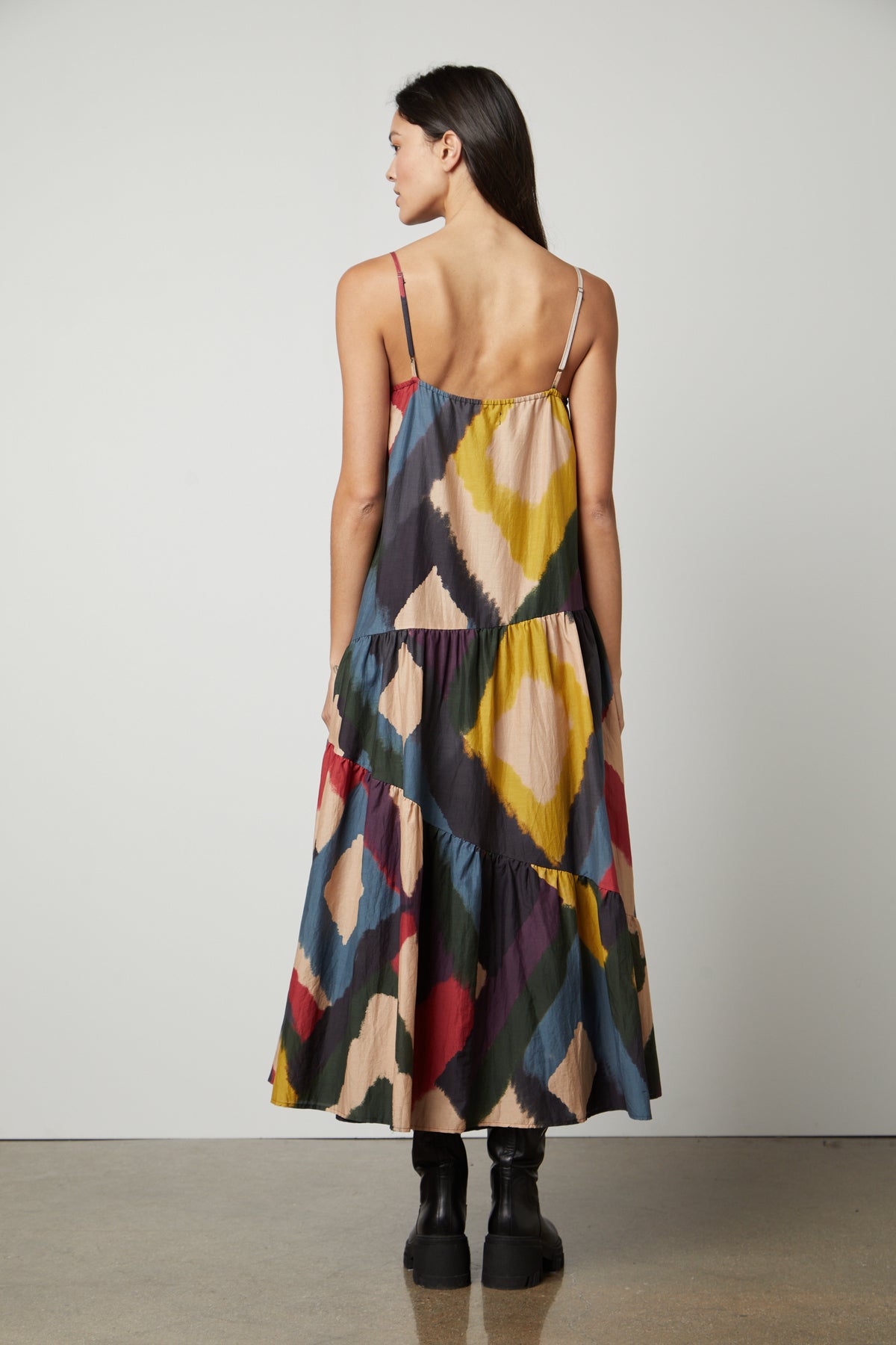 The back view of a woman wearing a Velvet by Graham & Spencer MARYANN PRINTED MAXI DRESS.-26861400391873