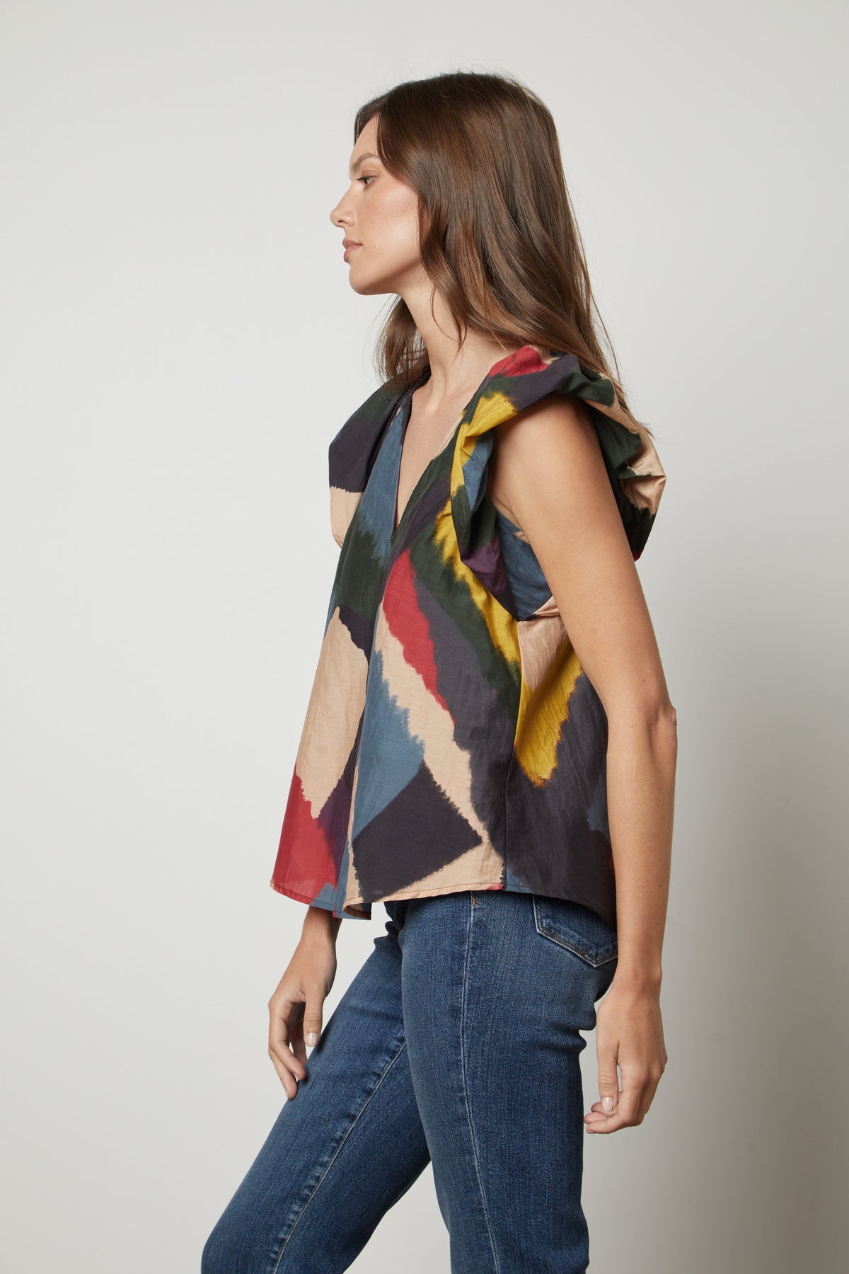   The model is wearing the Velvet by Graham & Spencer TAMARA PRINTED TOP with flutter sleeves. 