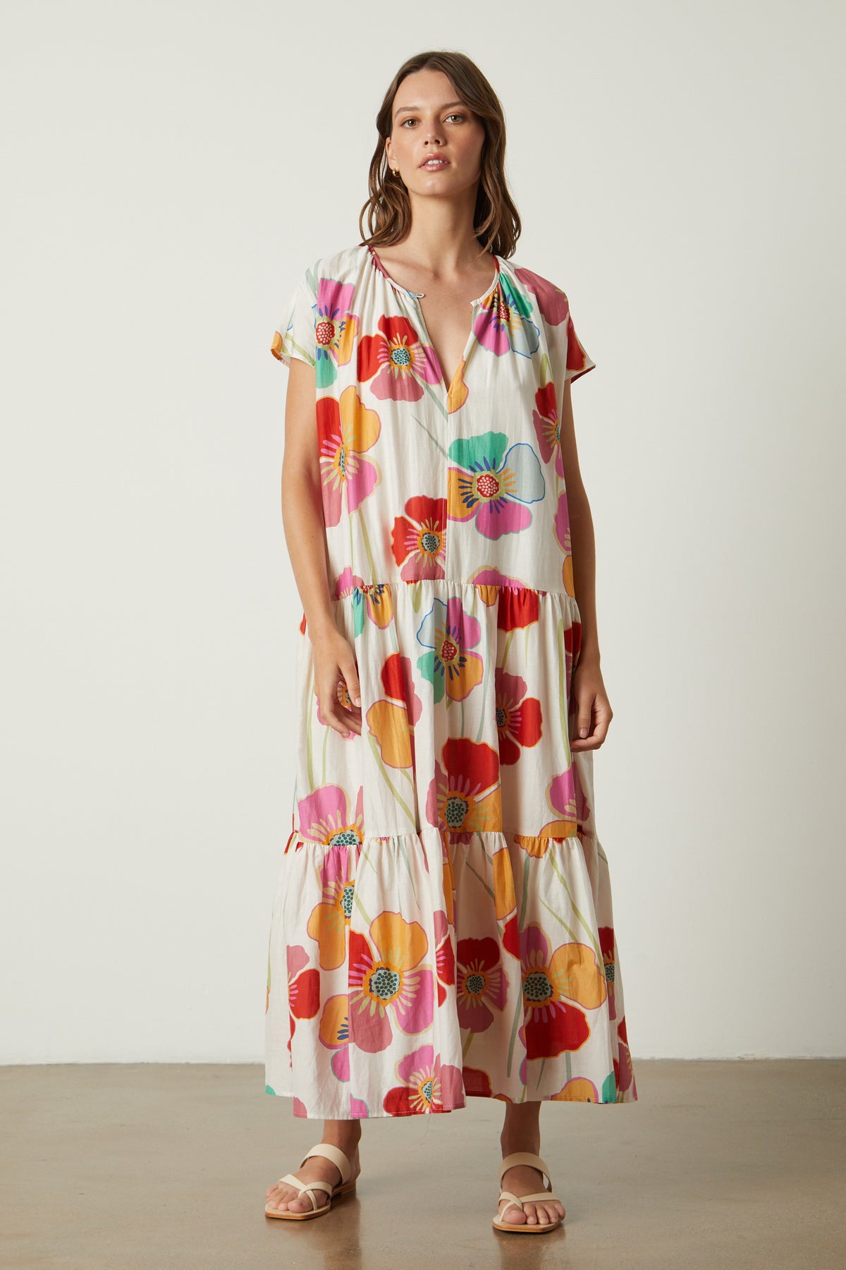 a woman wearing the SAVANNAH PRINTED MAXI DRESS by Velvet by Graham & Spencer, a multicolored tiered maxi dress.-26317107822785