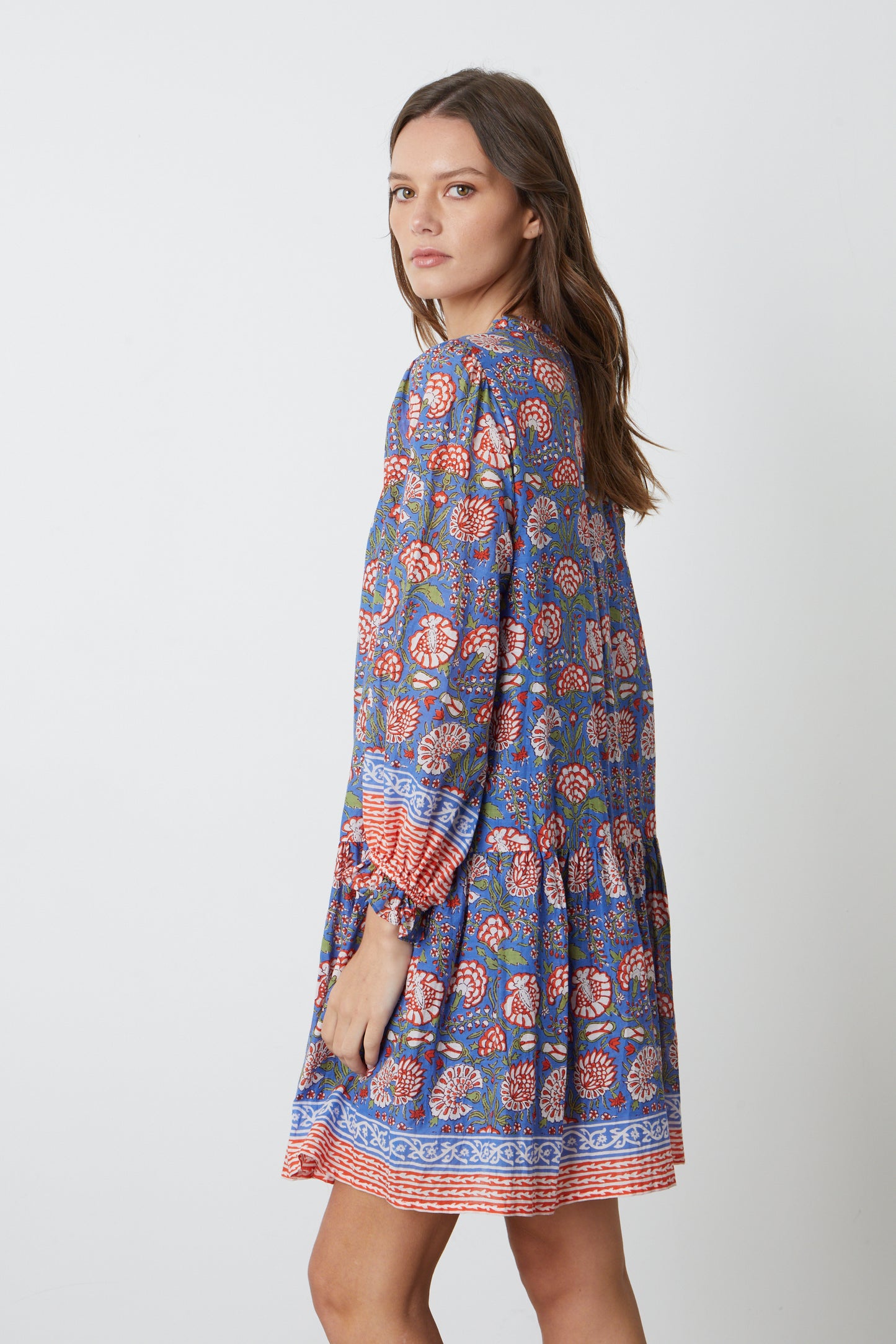 The model is wearing a Velvet by Graham & Spencer Juliette Printed Boho Dress.-26577349935297