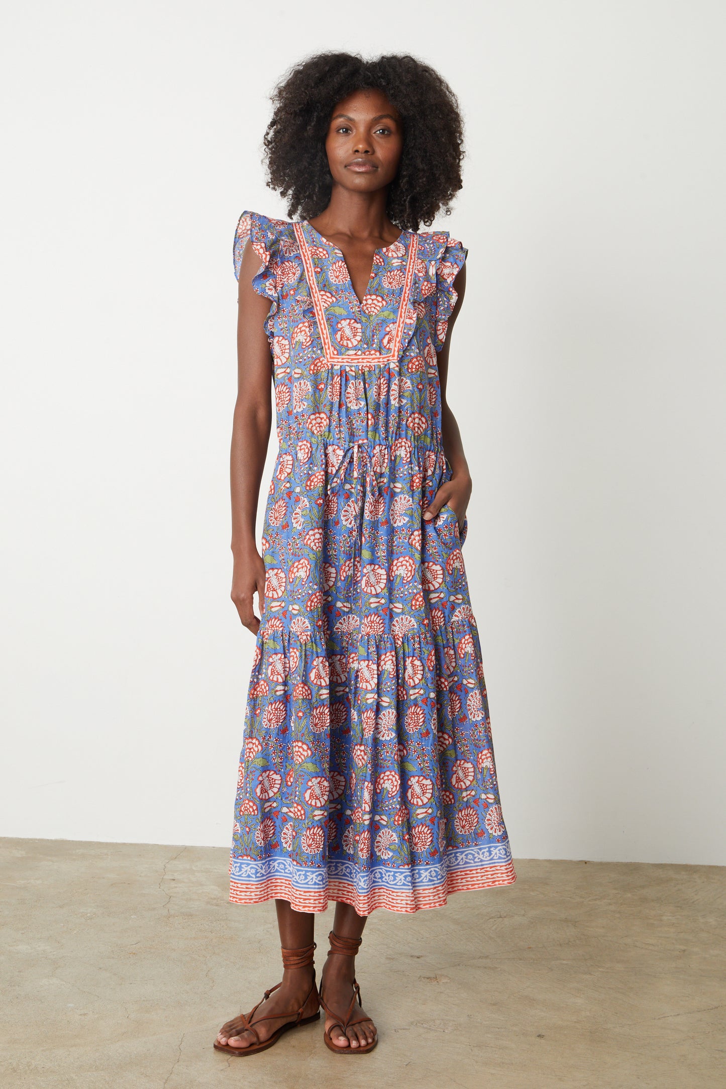 a woman wearing a blue and pink Velvet by Graham & Spencer ROSALIA PRINTED DRESS.-26577310974145