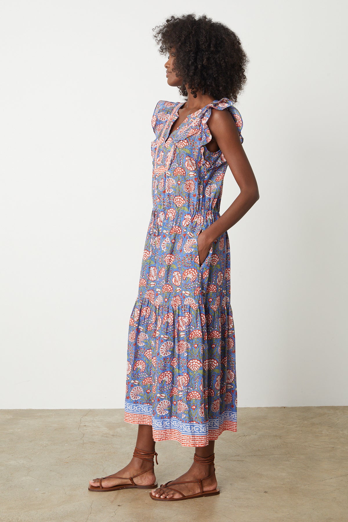 a woman wearing a ROSALIA PRINTED DRESS by Velvet by Graham & Spencer.-26577311006913