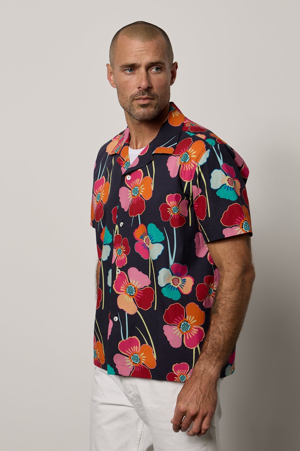   Iggy Button up shirt in Bahama print with large bold modern flower print on dark background with white denim front & side 