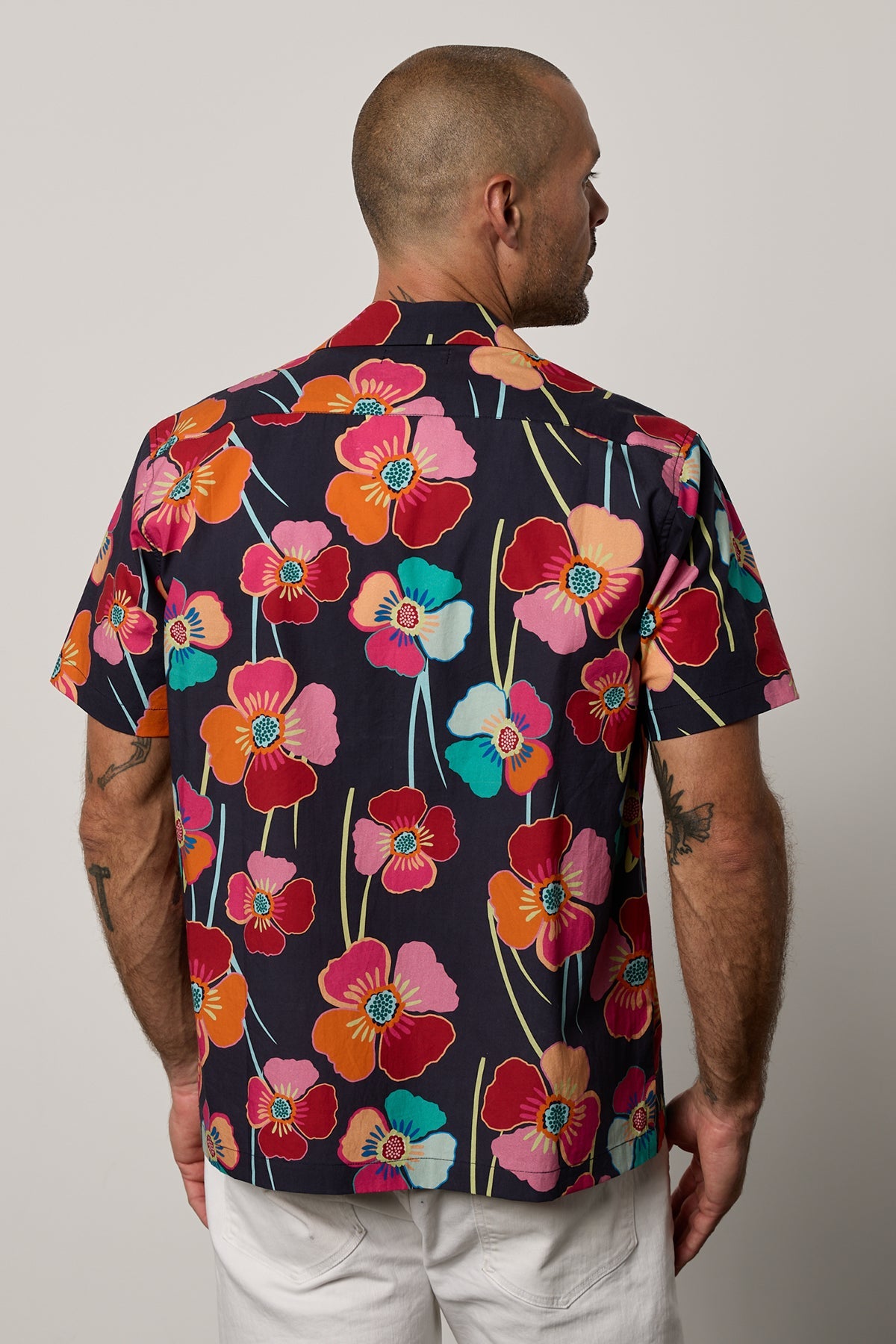   Iggy Button up shirt in Bahama print with large bold modern flower print on dark background with white denim back 