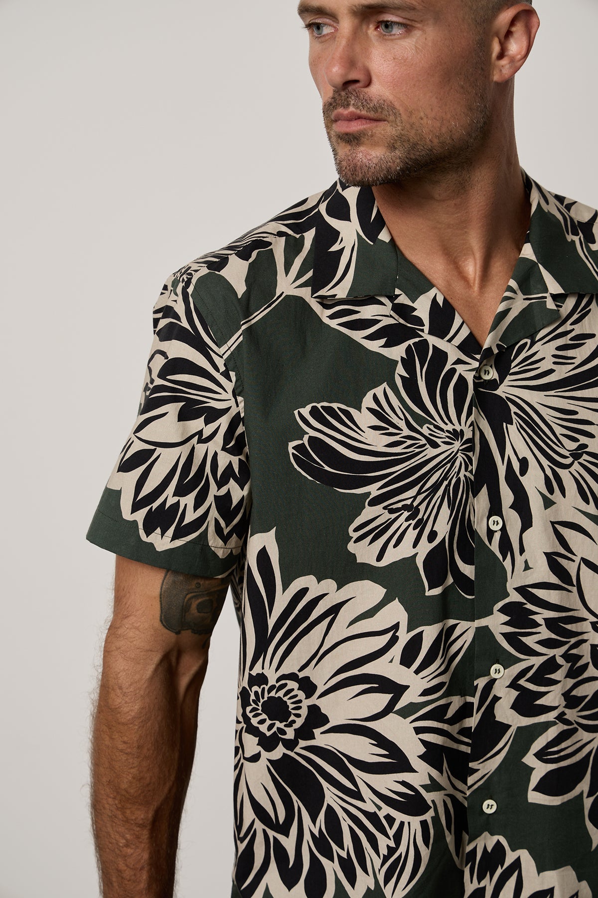 Iggy Button-Up Shirt in Catalina print with large bold black and cream abstract flower print on dark green background close up front-26801038885057