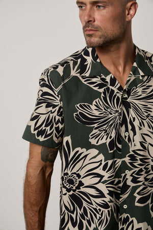 Iggy Button-Up Shirt in Catalina print with large bold black and cream abstract flower print on dark green background close up front