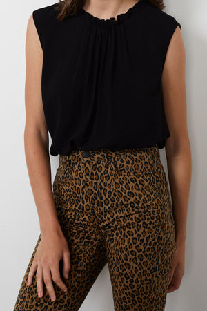 A woman wearing leopard print pants and Velvet by Graham & Spencer CHANELL STRAIGHT LEG DENIM.