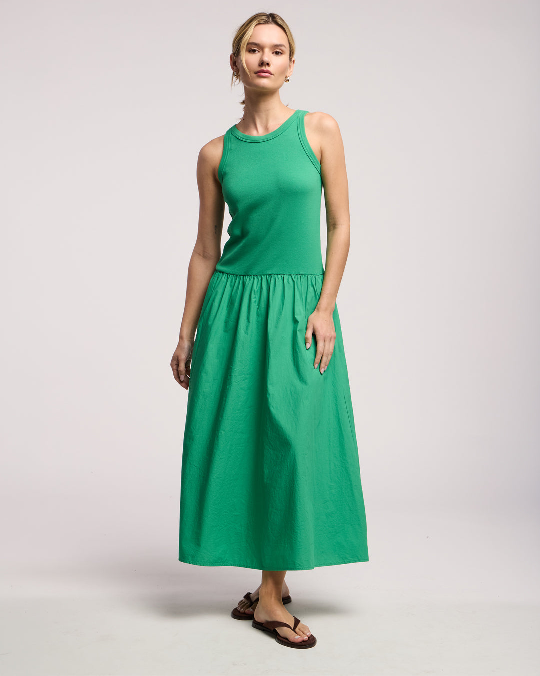 A woman wearing the Romilly Dress in Shamrock by Velvet by Graham & Spencer.