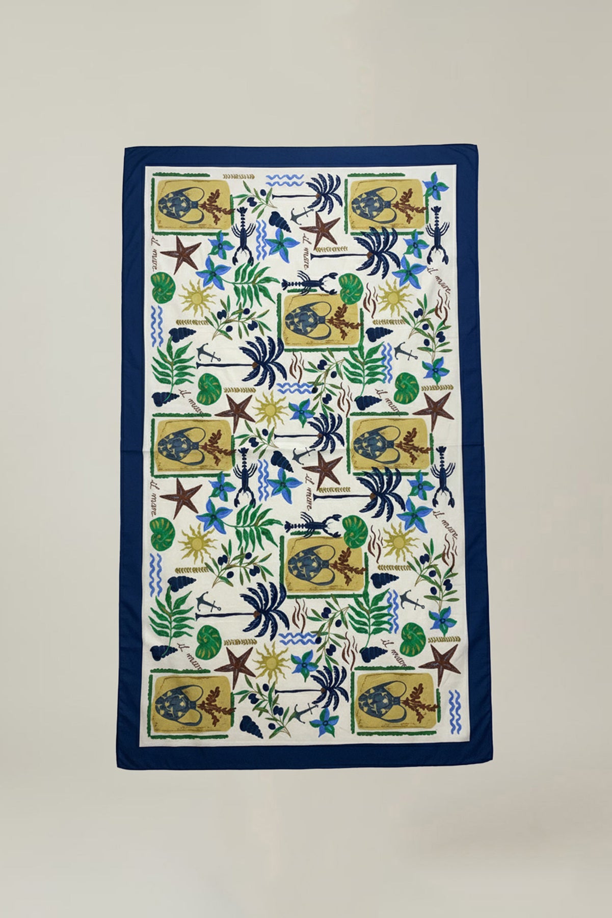 The ROBI SARONG by Velvet by Graham & Spencer is a rectangular cotton sarong with a blue border and a vibrant sea creature, plant, and shell pattern on white—ideal as a beach cover-up or stylish wrap skirt.