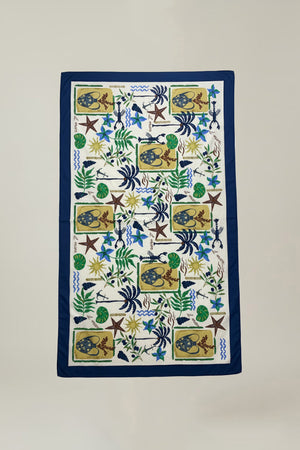 The ROBI SARONG by Velvet by Graham & Spencer is a rectangular cotton sarong with a blue border and a vibrant sea creature, plant, and shell pattern on white—ideal as a beach cover-up or stylish wrap skirt.