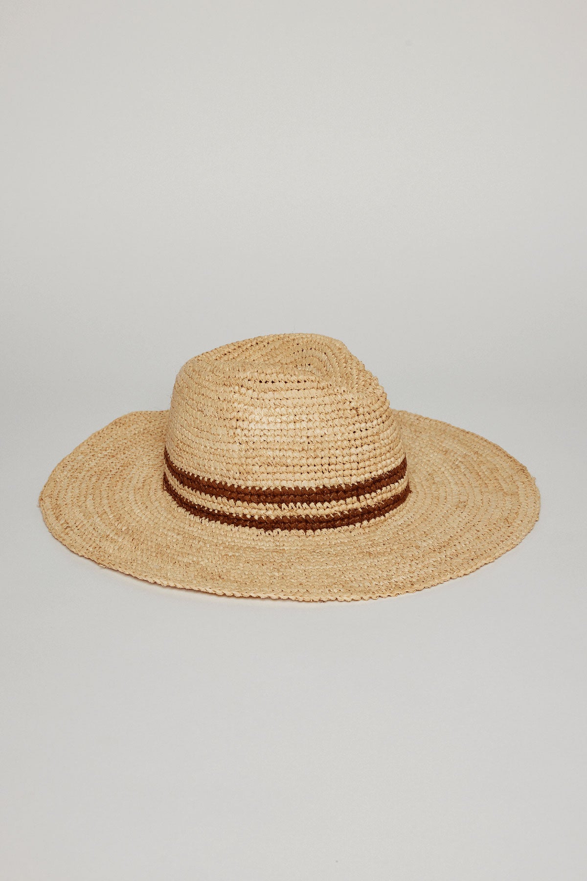 A SADONA RANCHER HAT by Velvet by Graham & Spencer with a wide brim and a brown ribbon detail, displayed against a plain light gray background.-36290925985985