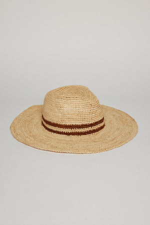 A SADONA RANCHER HAT by Velvet by Graham & Spencer with a wide brim and a brown ribbon detail, displayed against a plain light gray background.