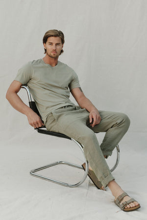 Samsen Short Sleeve V-neck Tee in Basical model sitting in chair