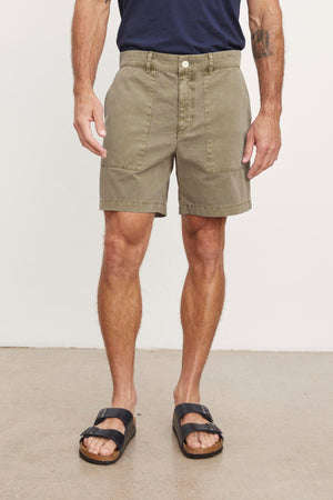A man wearing RAY SANDED TWILL SHORT shorts and Velvet by Graham & Spencer sandals.