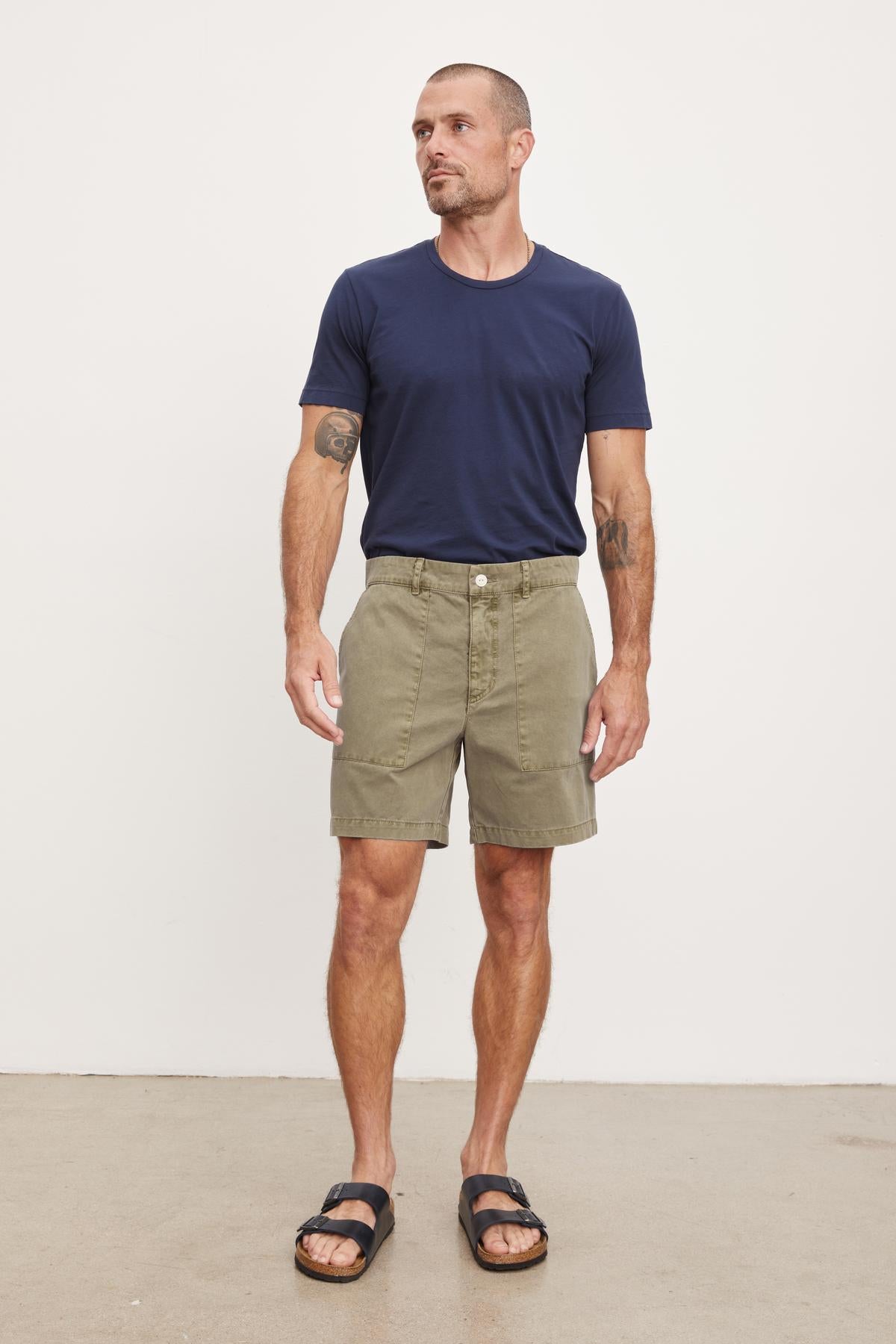   A man wearing Velvet by Graham & Spencer's RAY SANDED TWILL SHORT. 