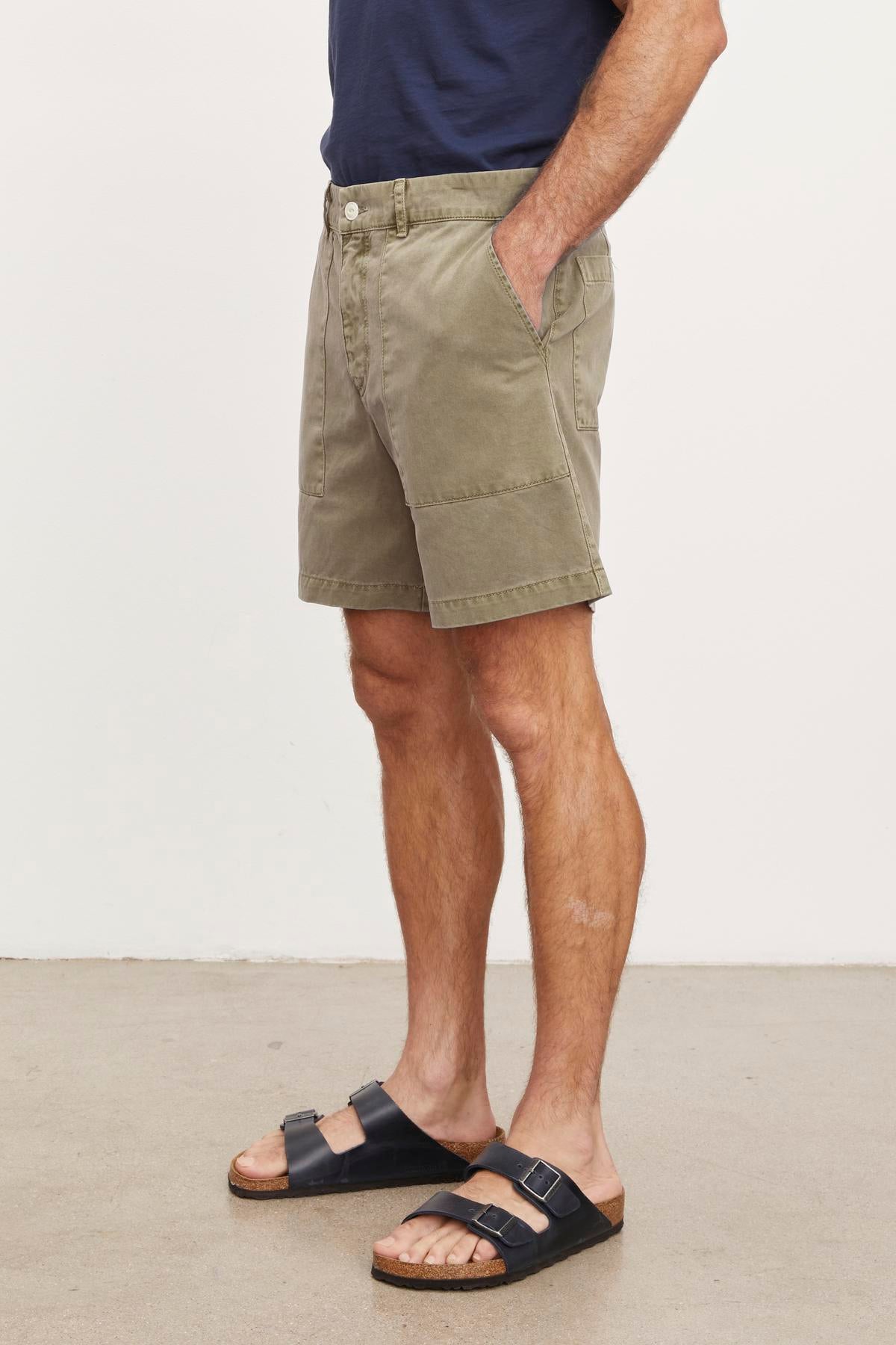 A man wearing Velvet by Graham & Spencer's RAY SANDED TWILL SHORTS and sandals.-36009107783873