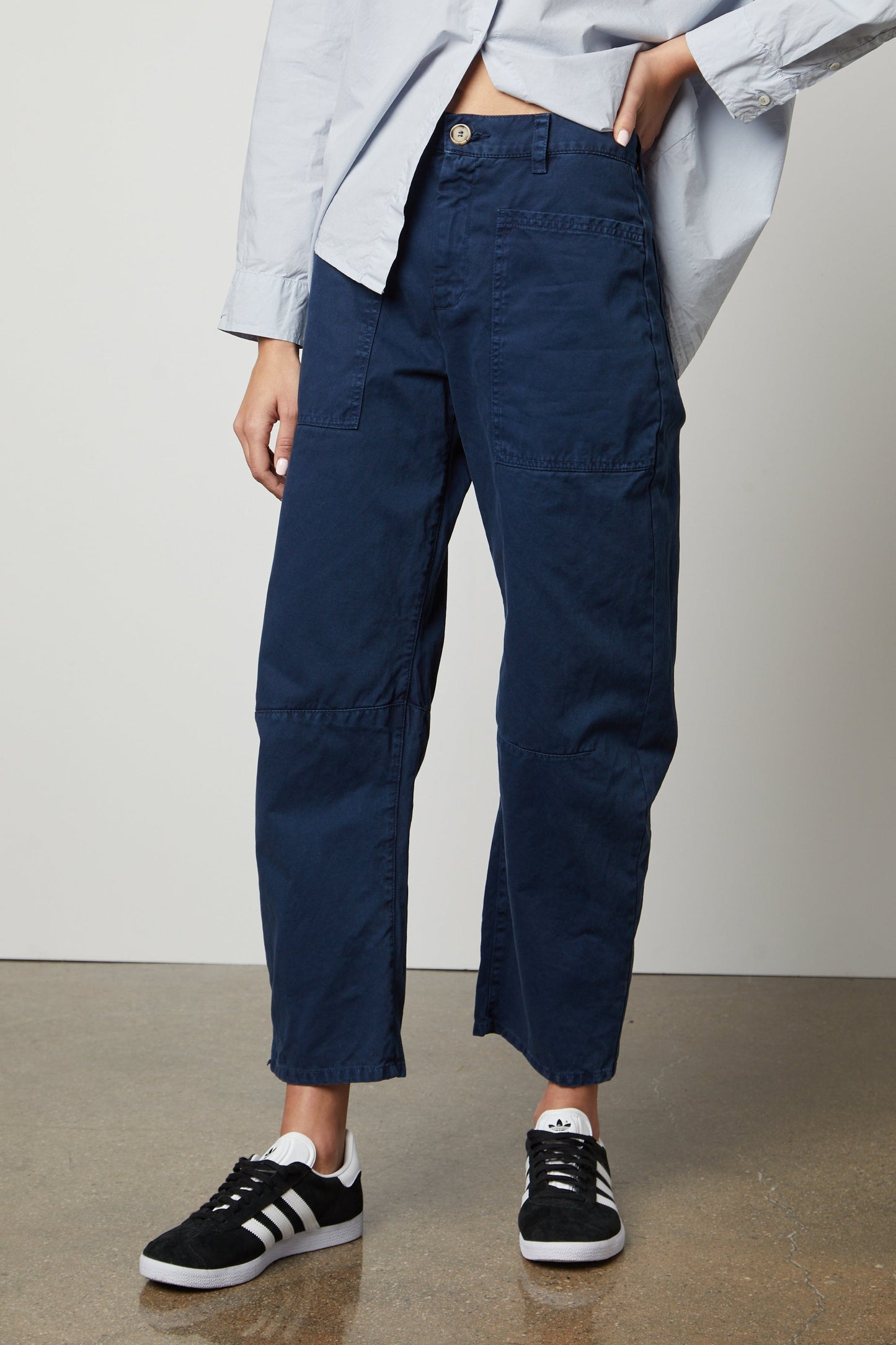 A woman wearing Velvet by Graham & Spencer BRYLIE SANDED TWILL UTILITY PANT and a white shirt.-36118556410049
