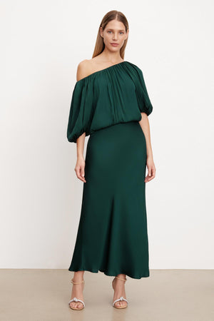 The TAMI SATIN PUFF SLEEVE TOP by Velvet by Graham & Spencer features an emerald green off the shoulder midi dress with a satin viscose fabric and a cropped top.