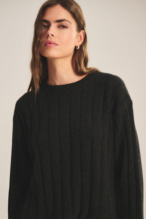 A person with long brown hair wears the SAWTELLE CASHMERE SWEATER by Velvet by Jenny Graham against a neutral background, looking slightly off camera.